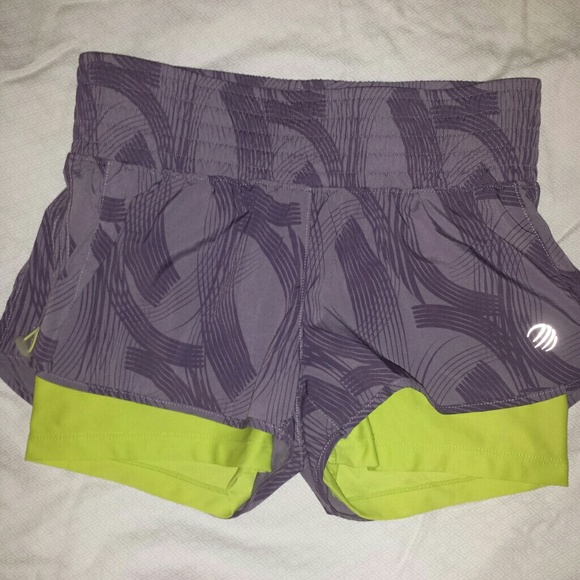 Green and purple running shorts