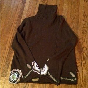 Brown crocheted flower turtleneck sweater