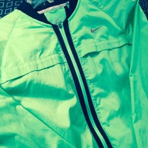 Neon green Nike running jacket.