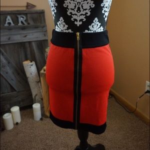 Fitted red and black front zipper skirt