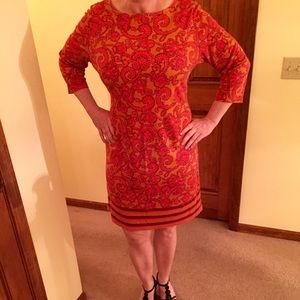 Rich rust and orange knit 3/4 sleeve dress!
