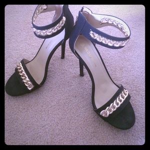 Black strapped gold chain heels