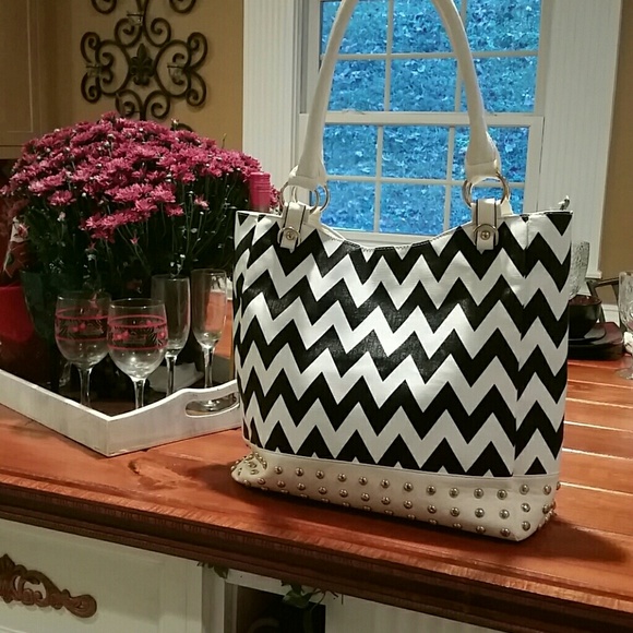 White and black handbag with studded detailing