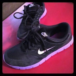 Purple and black nikes