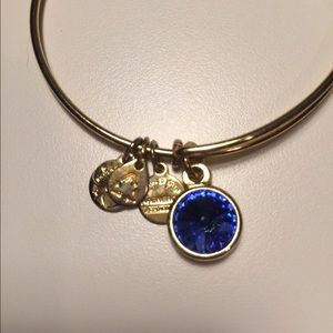 Gold Alex & Ani bracelet with Sapphire charm
