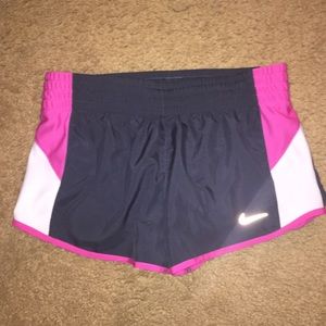 grey and pink Nike shorts