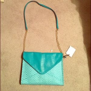 New blue leather and chain strap cross body