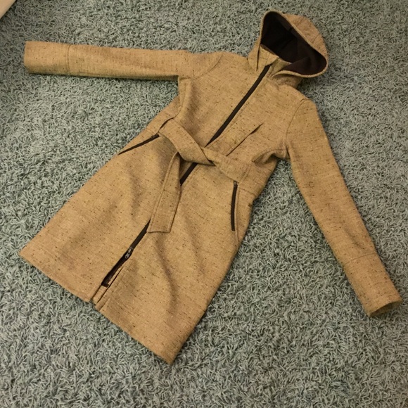 Warm tweedy raincoat with hood and thumb hook.