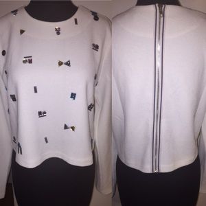 White sweater with crystal detailed studs