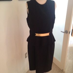Black peplum dress with gold belt