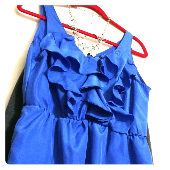 Blue ruffled sleeveless blouse
