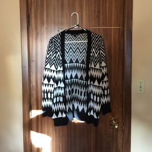 Black and white patterned cardigan.