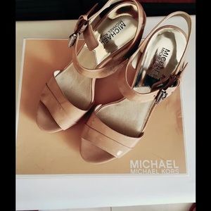 MK wedge shoes with transparent heels.