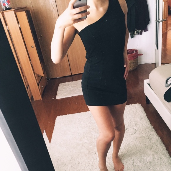 Black one shoulder dress.