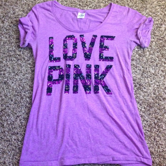 Scooped neck purple t-shirt with rolled sleeves.