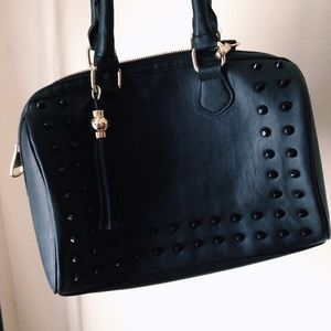 black studded duffle bag