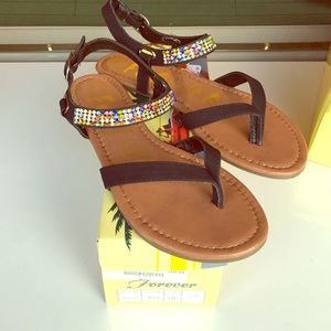 Black sandals with rainbow gemstones