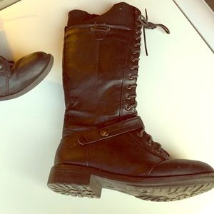 Black, long, stretchy, fabric combat boots.