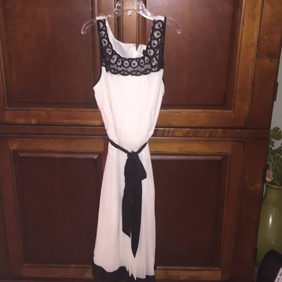 White dress with black lace. Never worn