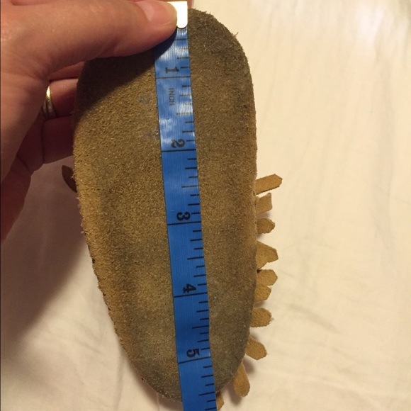 Minnetonka moccasins. Size 4 toddler Tan leather.
