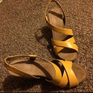 Mustard yellow sandal wedges.