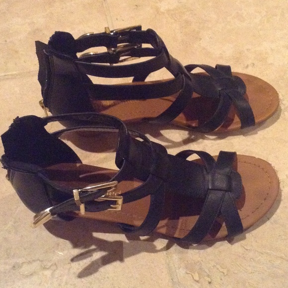 Black gladiators with gold buckles