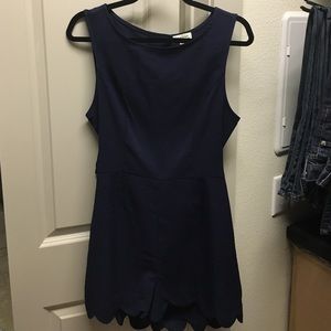 Navy romper with scalloped detail