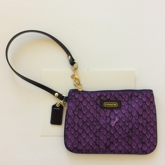 Coach Handbags - Coach Taylor Snake Print Wristlet in purple