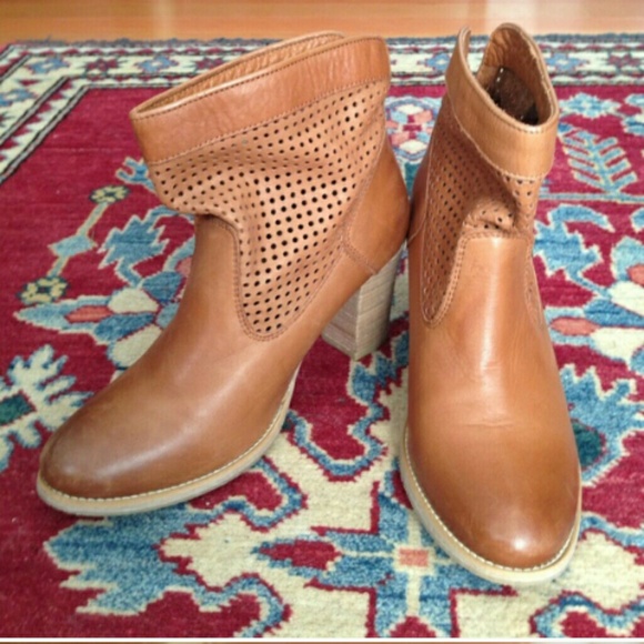 Tan boots with perforated sides