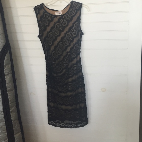 M. S. S. P. Elegant yet sexy little black dress.