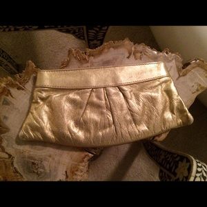Metallic gold clutch