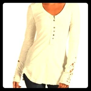 Free people long sleeve with lace detail on arms.
