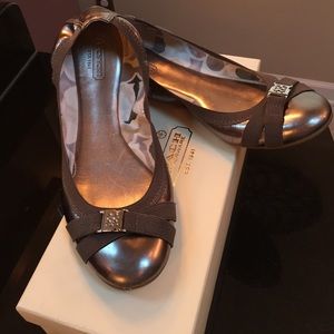Stylish Coach flats in metallic Pewter.