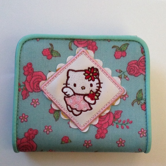 Sanrio Handbags - Faux leather trim Hello Kitty w/roses wallet.
