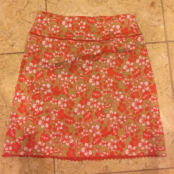 Pretty tan and orange skirt with flowers.