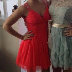 Salmon colored open back short formal dress