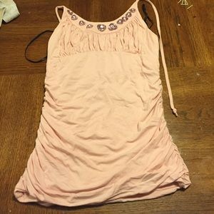 Really cute pink top aligned with heart buttons