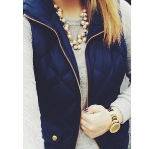Navy blue vest with fur hood.