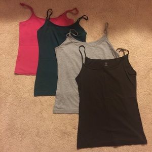 Four medium camisoles/tank tops