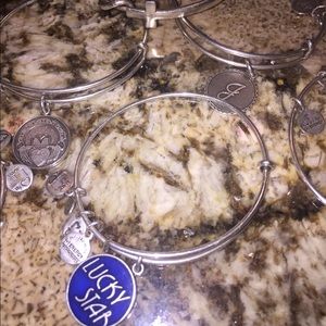 Eight Alex and Ani bracelets