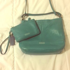 Green leather coach with matching wallet