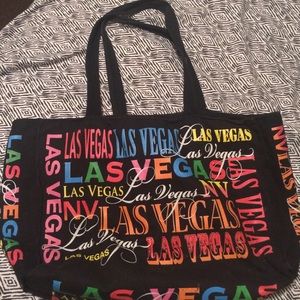 Black bag with Las Vegas printed in multicolor.