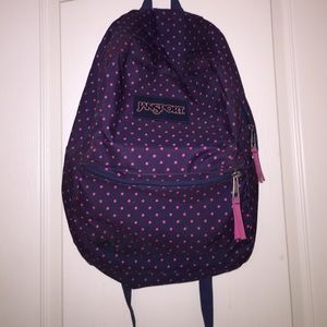 navy blue jansport with pink polka dots