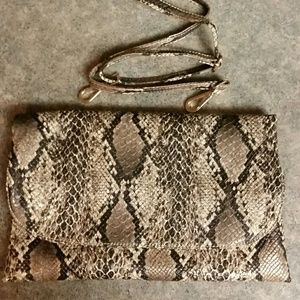 Oversized snake print clutch