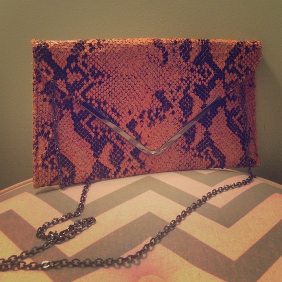 Tangerine snakeskin envelope clutch with chain