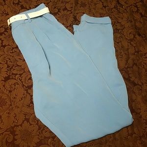 Light blue loose dress pants with white belt.