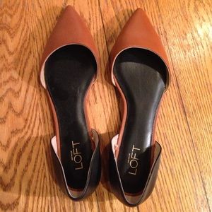 Tan and black ballet flats