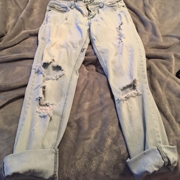 Light blue very ripped jeans