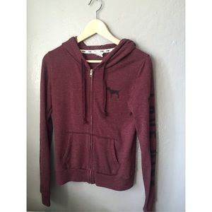 Pink zip up sweater.