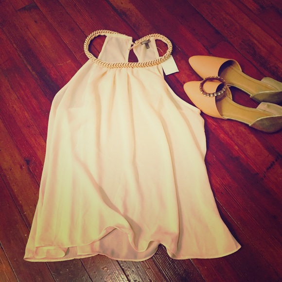 Pale pink flowy halter shirt.